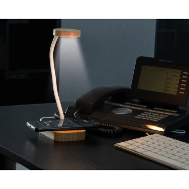 Logo trade ärikingi pilt: Juhtmeta laadijaga laualampTomsk